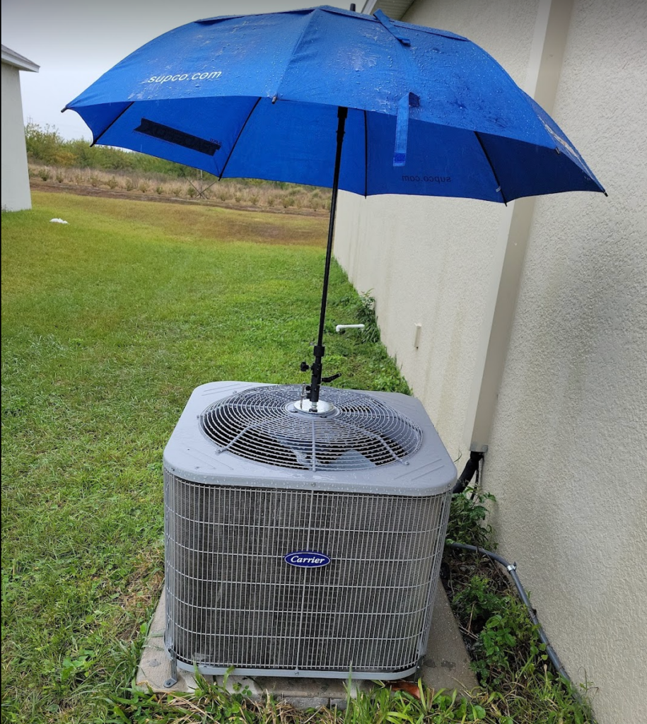 picture of condenser with umbrella for working in rain.